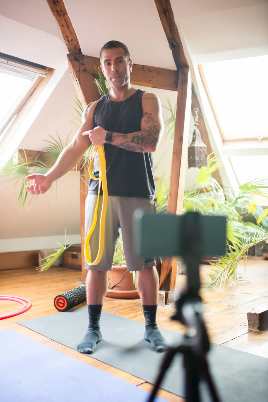 Online fitness coach recording a workout session for coaching clients