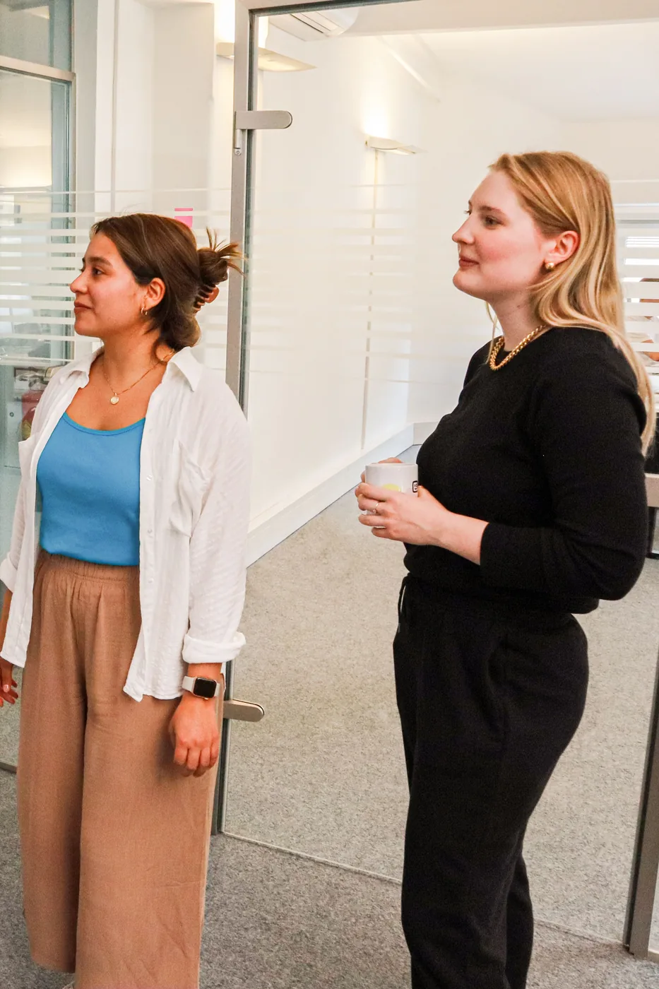 Social media agency team reviewing a client's social wall dashboard